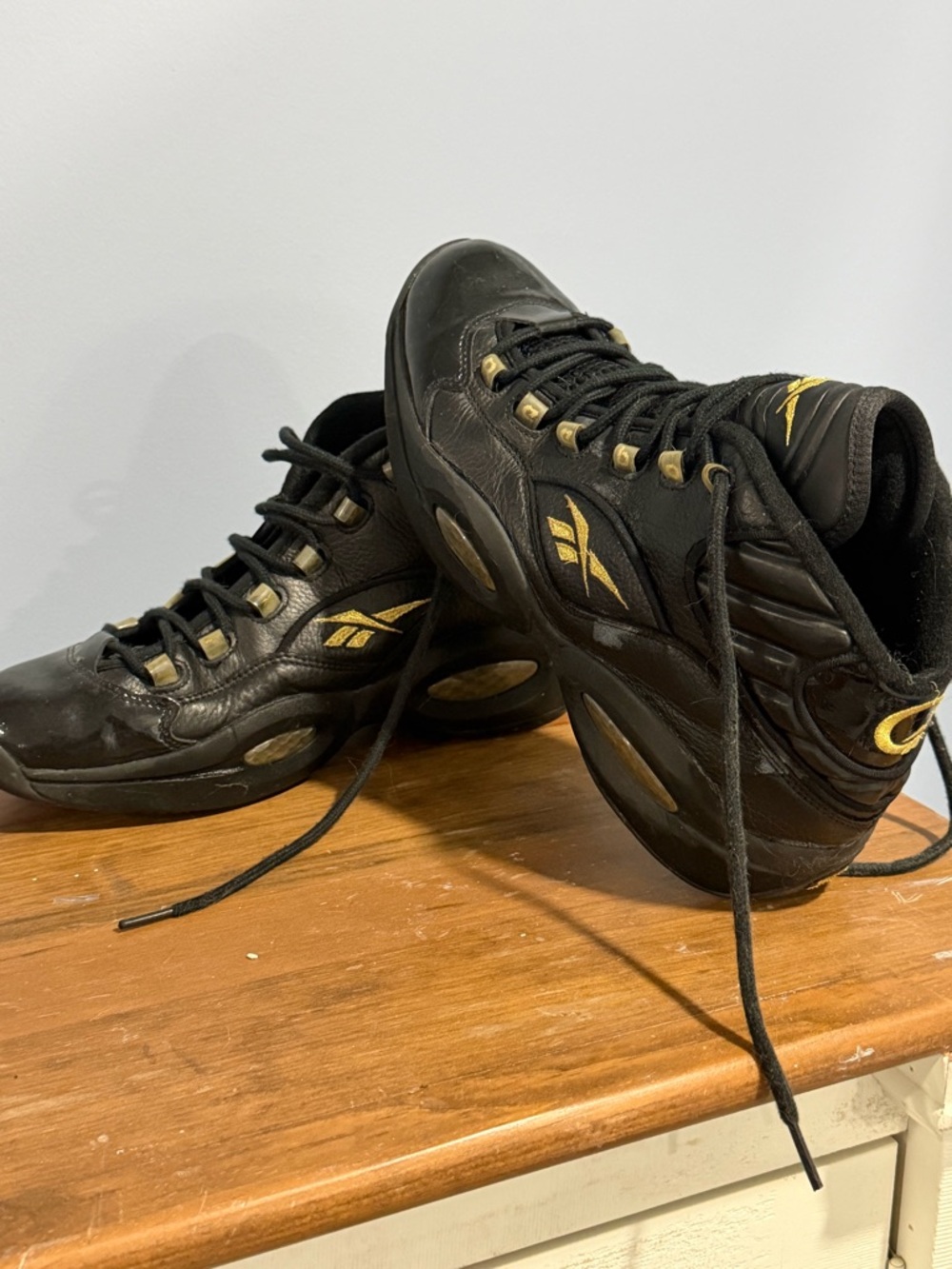 Reebok Men's Black and Gold The Question
Allen Iverson Shoes
